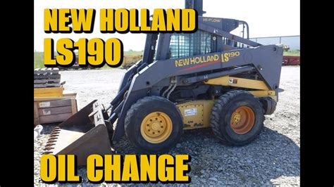 how to change oil in a new holland skid steer|new holland l553 oil change.